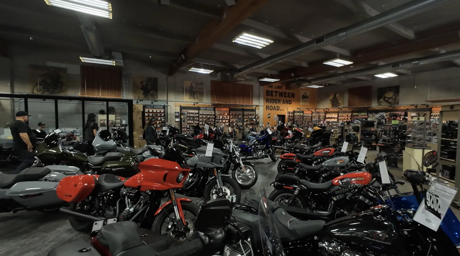 Harley-Davidson dealership showroom floor lined with new motorcycles