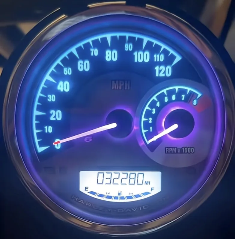 Harley-Davidson odometer reading 32,280 miles on a high-mileage motorcycle