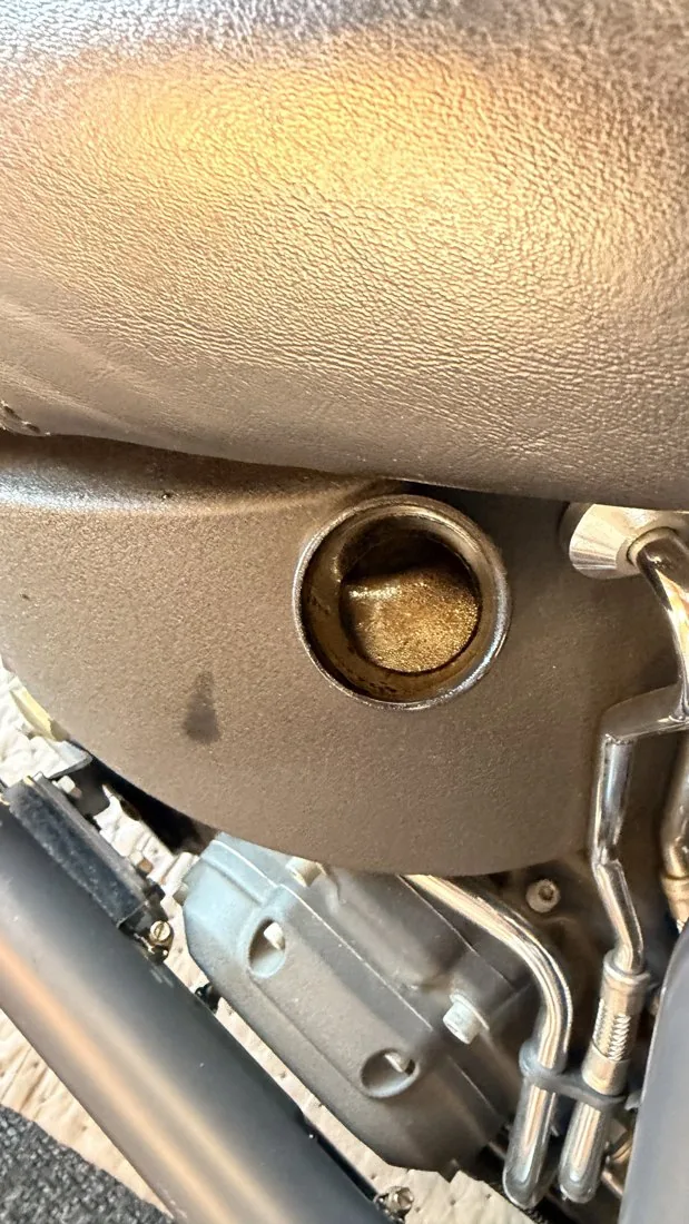 Looking down the oil tank filler of a 2007 Harley Softail at the engine oil