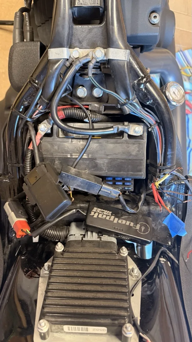 Seat off my Night Train: battery, fuse block and wiring open for electrical work